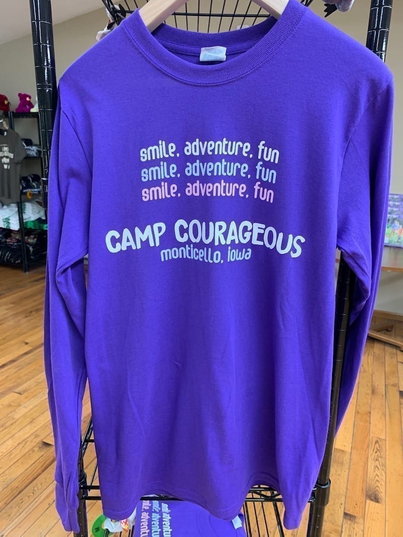 Smile, Adventure, Fun graphic purple long-sleeved t-shirt.