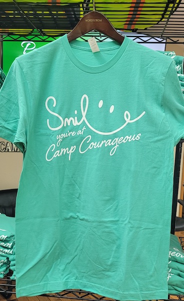 mint green t-shirt with a smile graphic